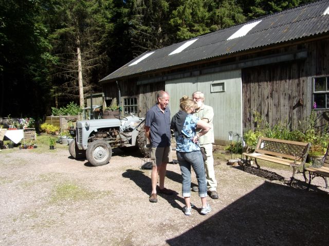 Discussing gardens, tractors and benches!